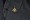 View of the Sukhoi Su-30 MKI lapel pin on a black blazer.